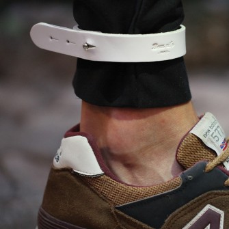 White leather bike pant strap